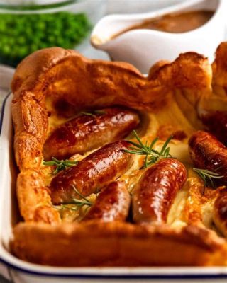  Le Toad-in-the-Hole: Une explosion de saveurs gourmandes enrobées d'une croûte dorée et croustillante !